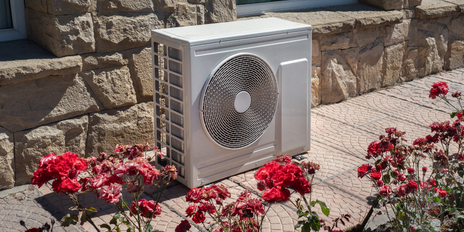Heat Pump outside of home - Eco-Friendly HVAC Systems: Your Green Heating & Cooling Guide